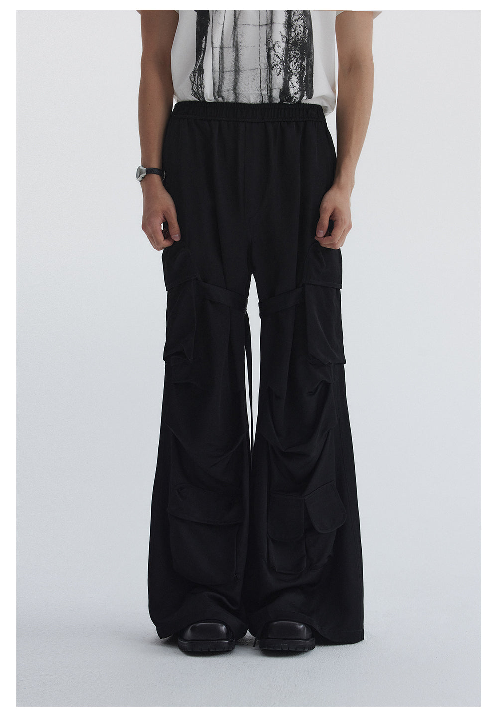 Straight pants with irregular design straps