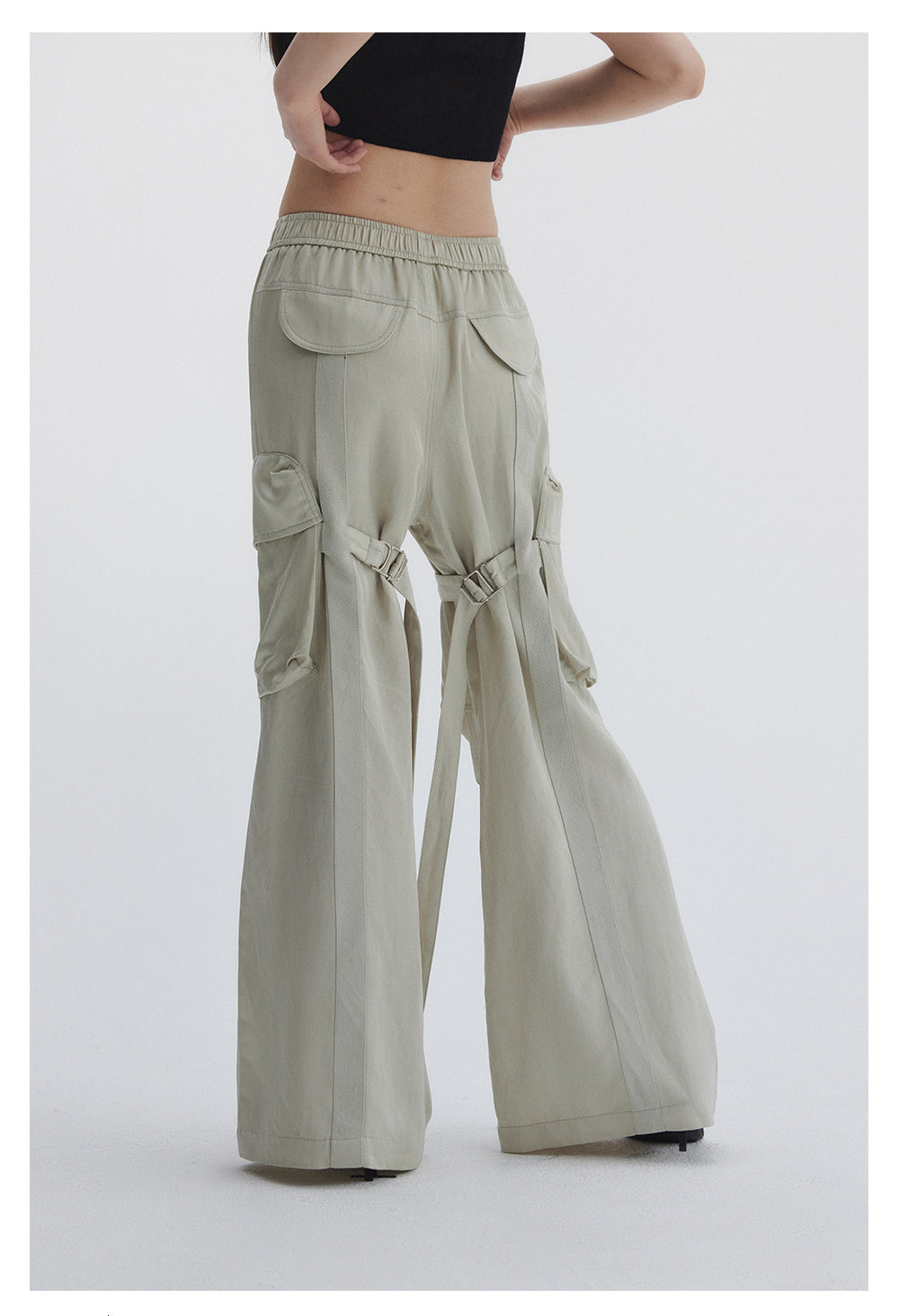 Straight pants with irregular design straps