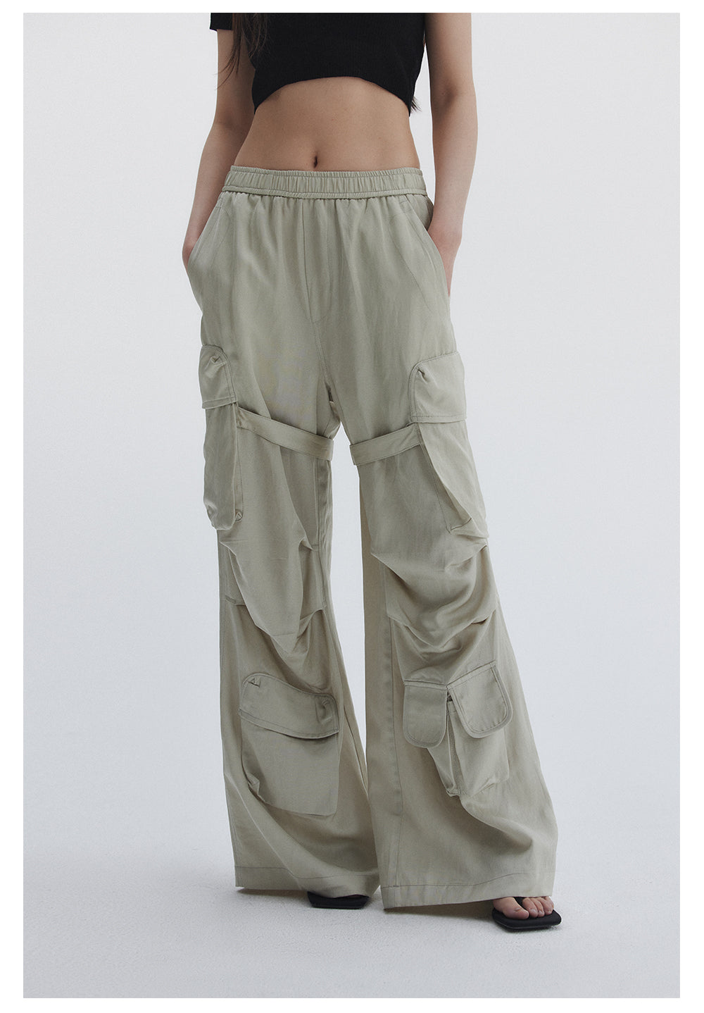 Straight pants with irregular design straps