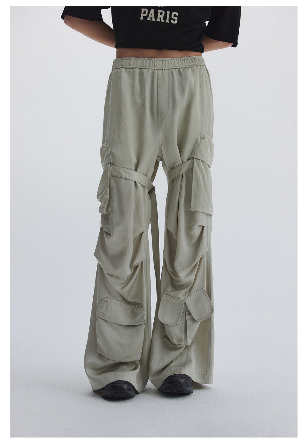 Straight pants with irregular design straps