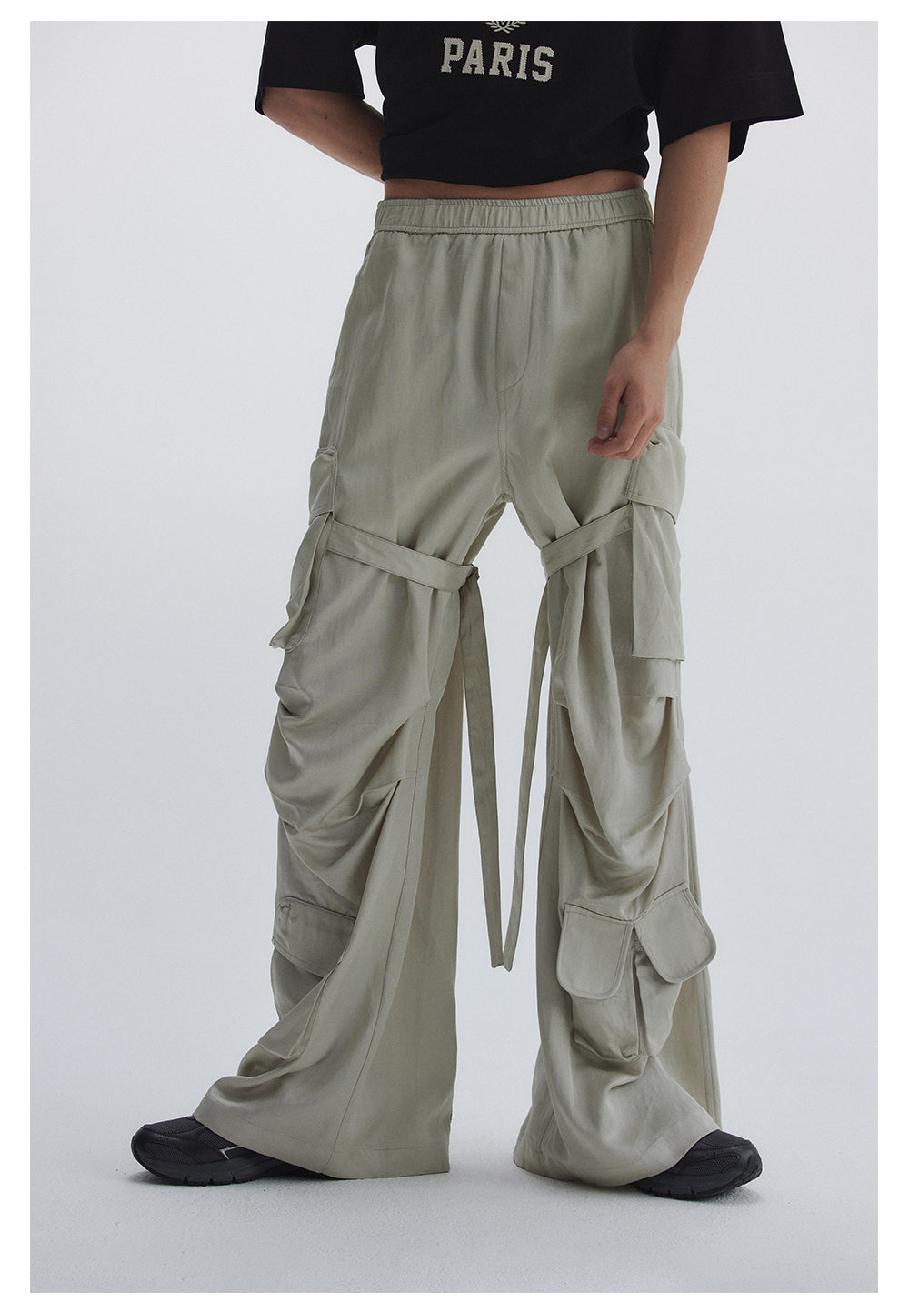 Straight pants with irregular design straps