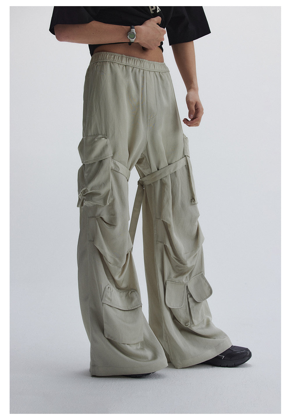 Straight pants with irregular design straps