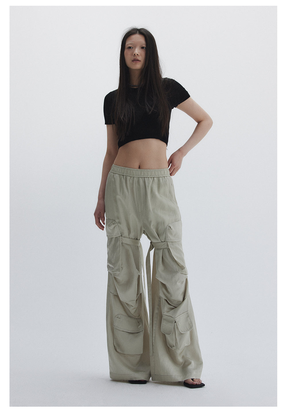 Straight pants with irregular design straps