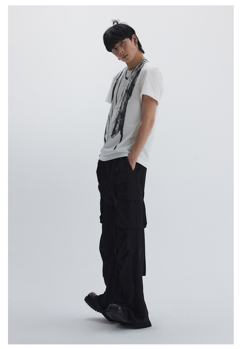 Straight pants with irregular design straps