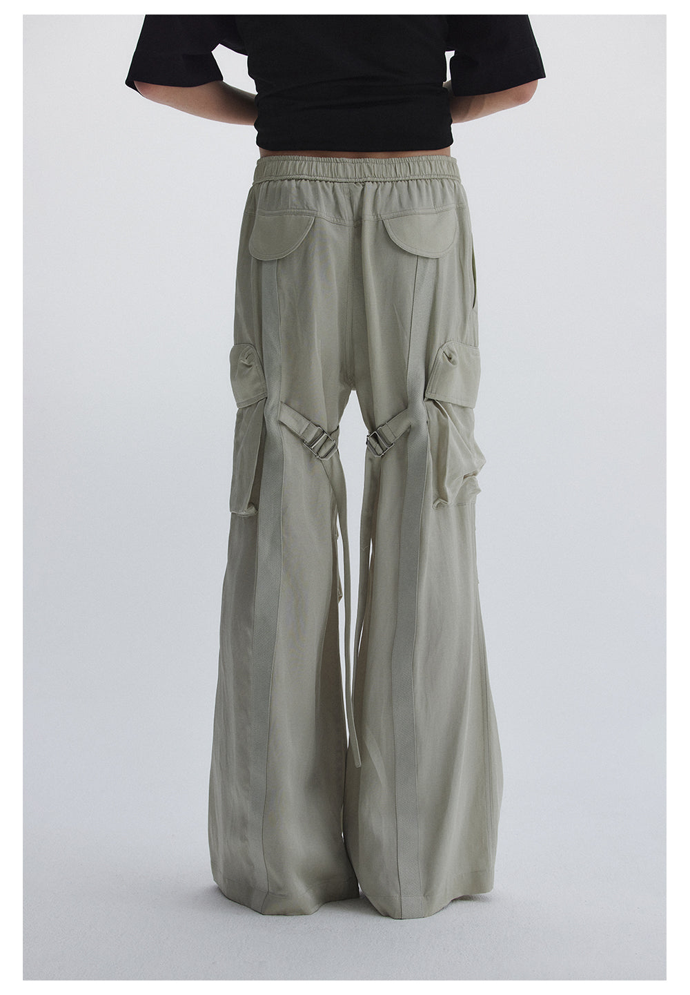 Straight pants with irregular design straps