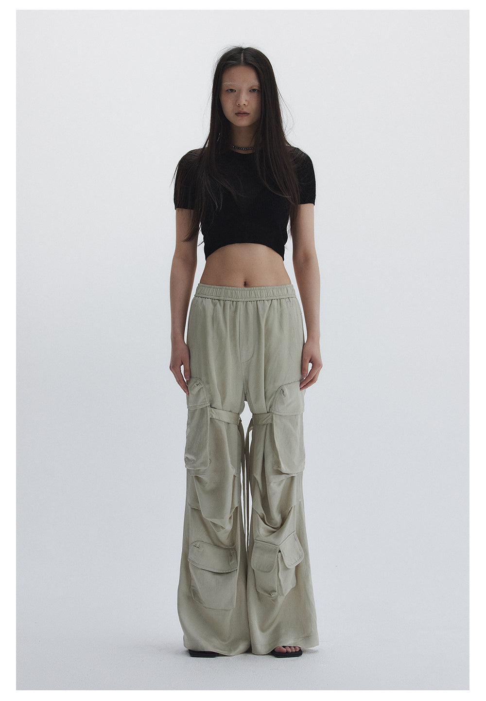 Straight pants with irregular design straps