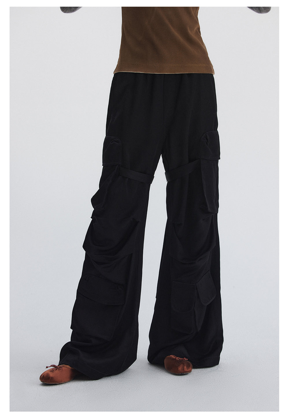 Straight pants with irregular design straps