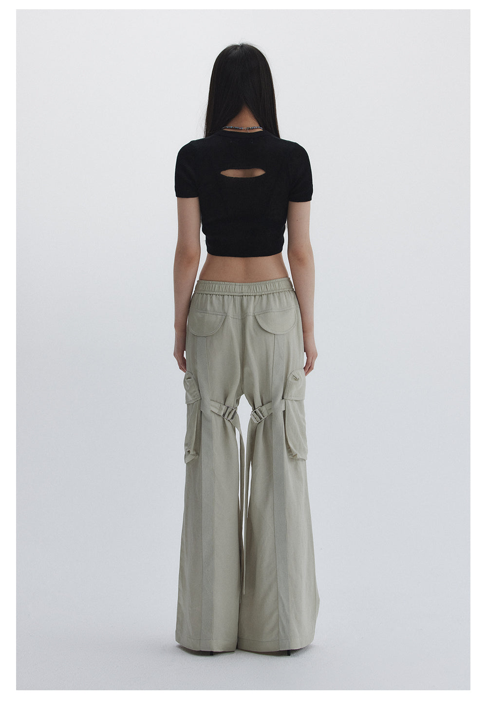 Straight pants with irregular design straps