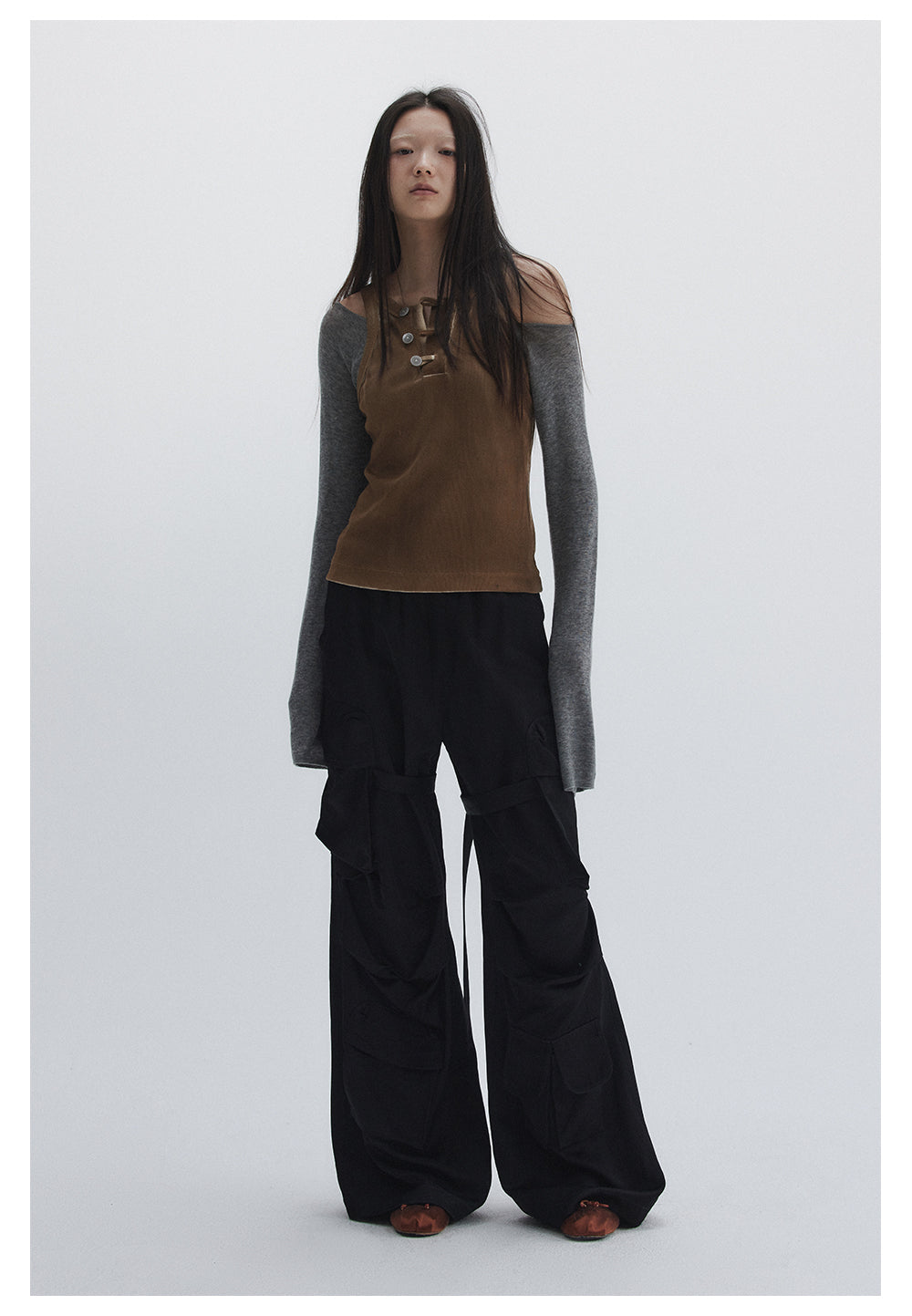 Straight pants with irregular design straps