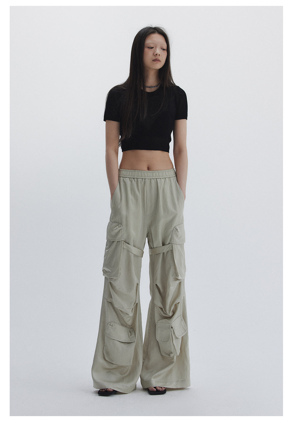 Straight pants with irregular design straps