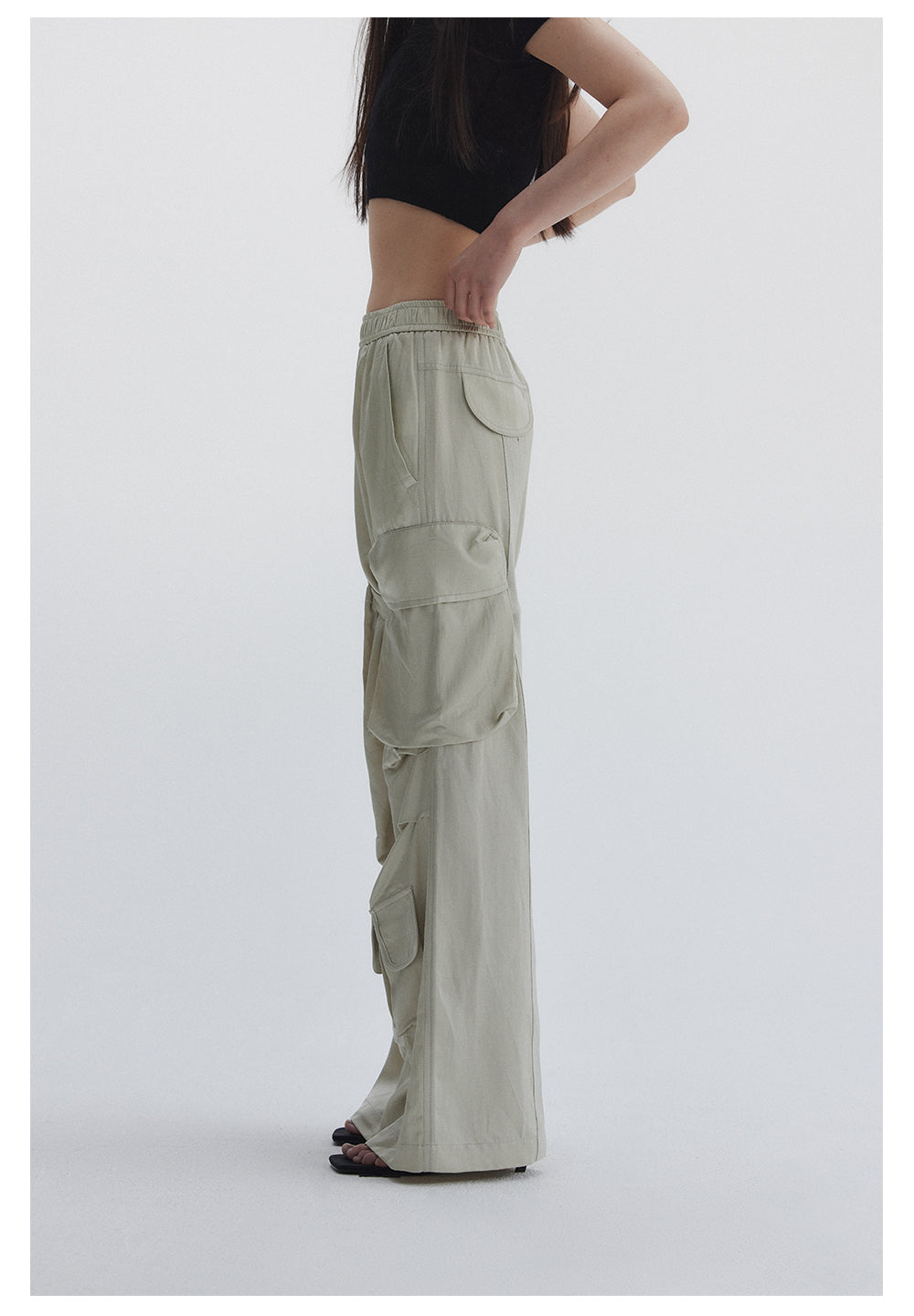 Straight pants with irregular design straps