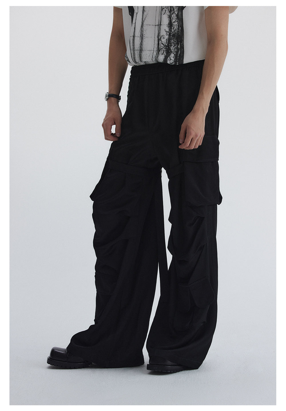 Straight pants with irregular design straps