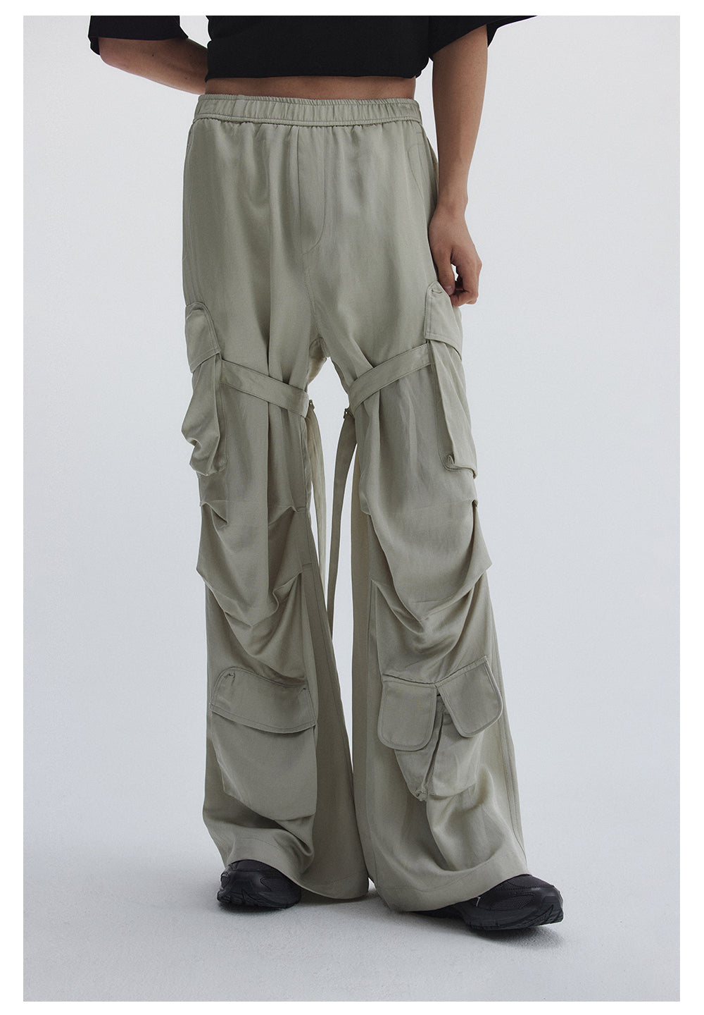 Straight pants with irregular design straps