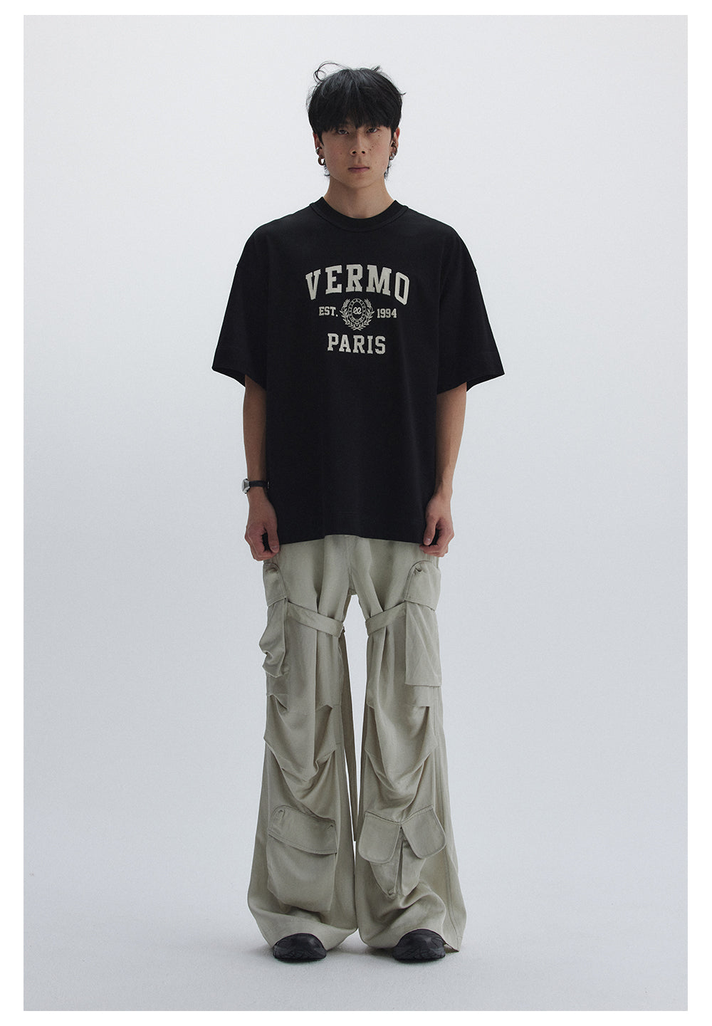 Straight pants with irregular design straps